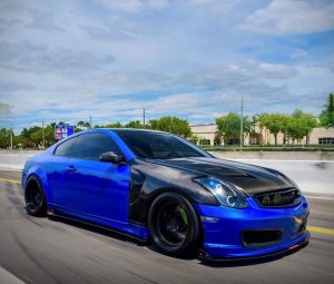 Blue Modded G35 with carbon fiber front fenders and hood with black wheels